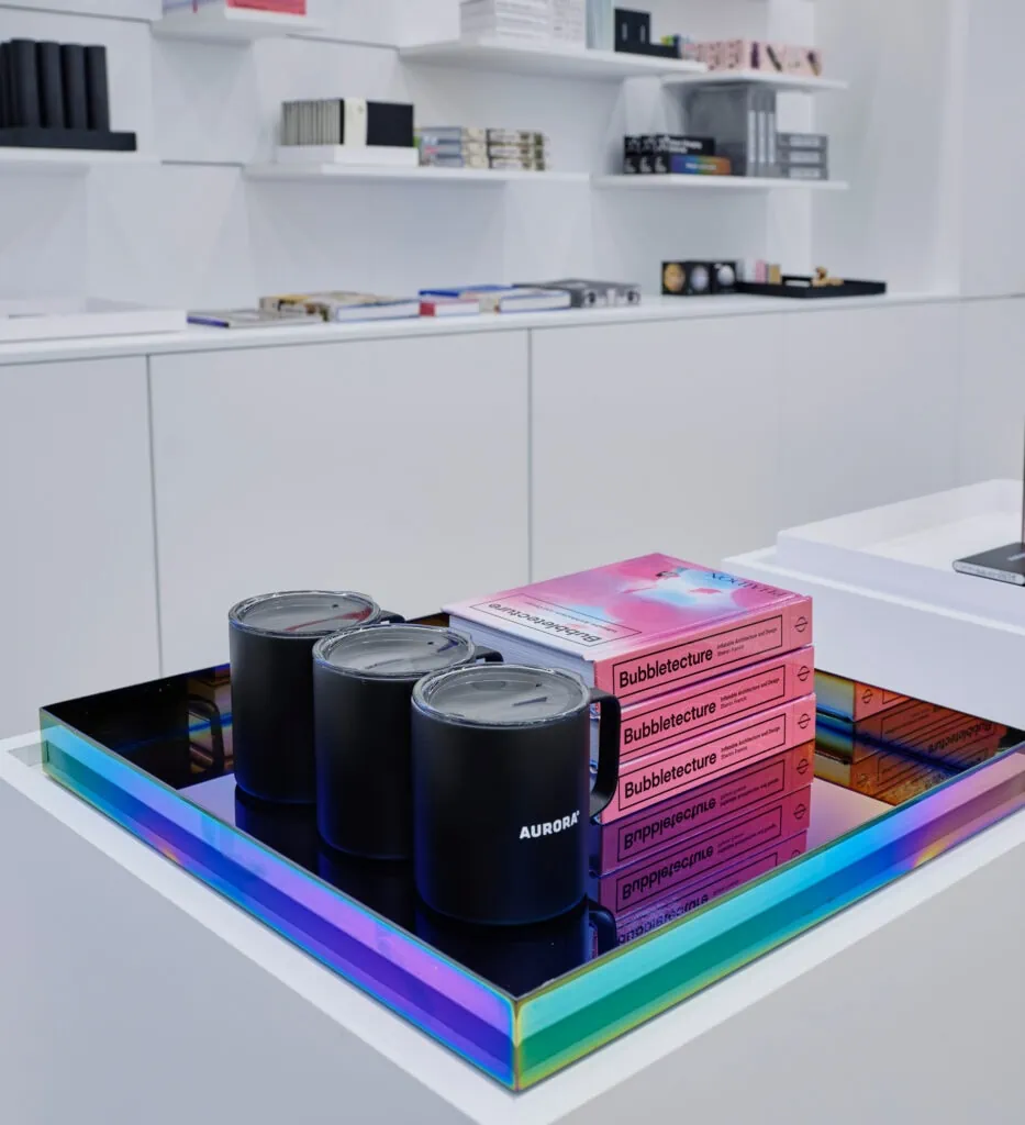 display showcasing insulated mugs and books