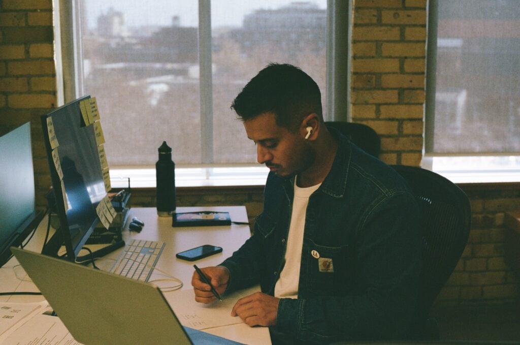 Creative Director Alex working at his office desk